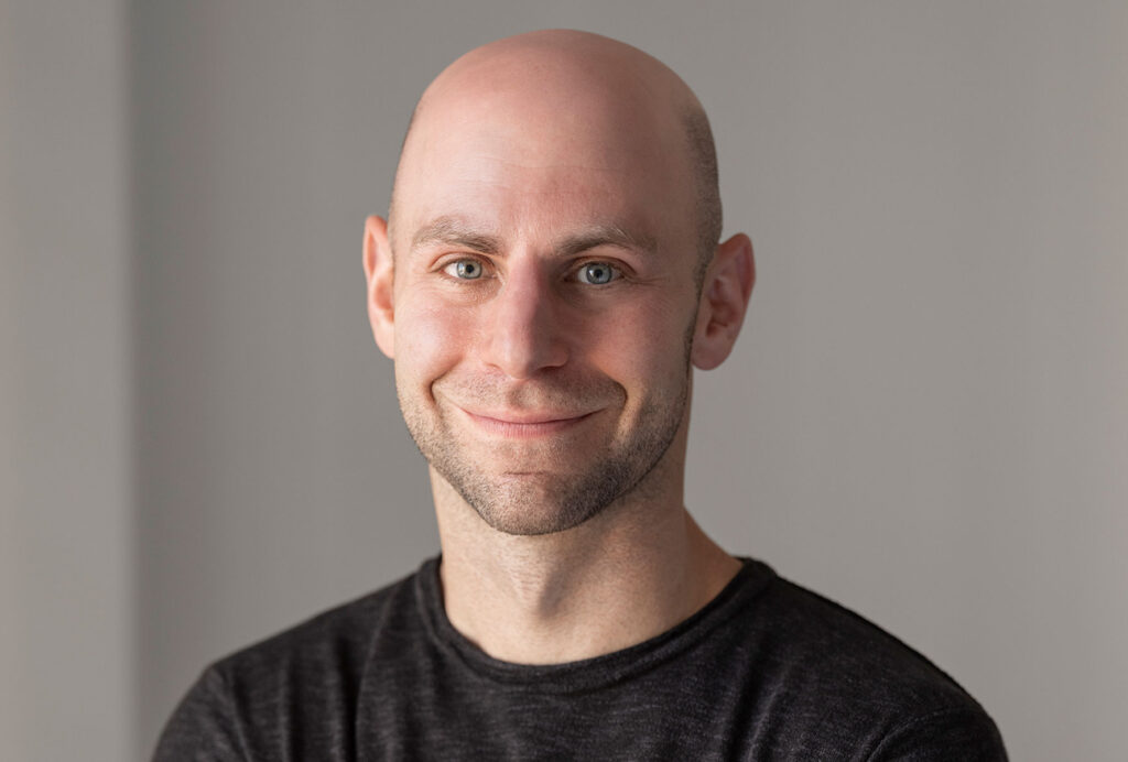 Adam Grant in black t shirt